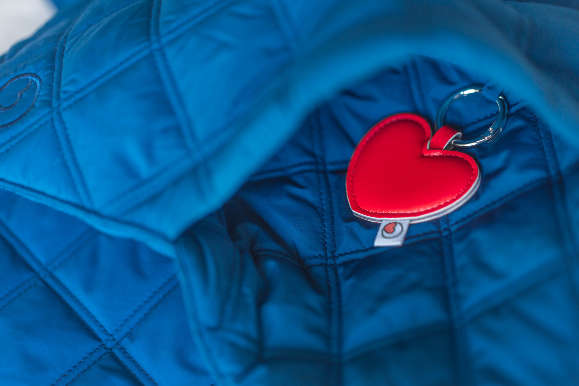 Heart keychain clipped inside the scarf pocket