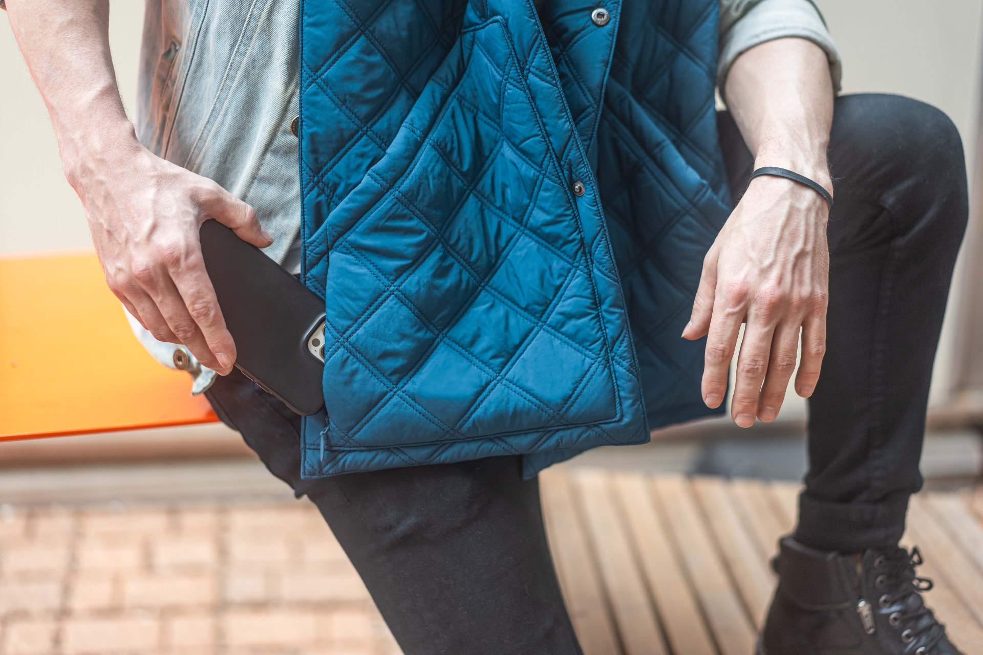 Close-up of the hidden zipper pocket with passport, phone and wallet